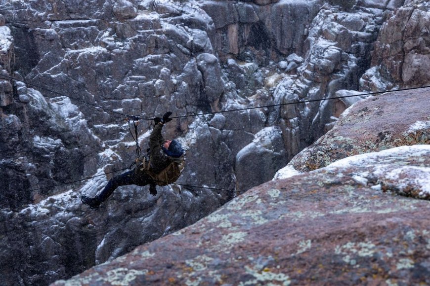 WATCH: Bradley Cooper Dangles over Ravine in this Exclusive ‘Running Wild’ Clip