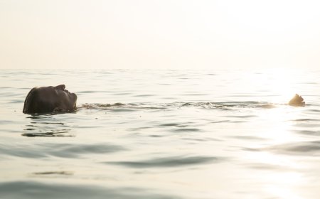 Man Accidentally Crashes Beach Fashion Show to Go for a Swim