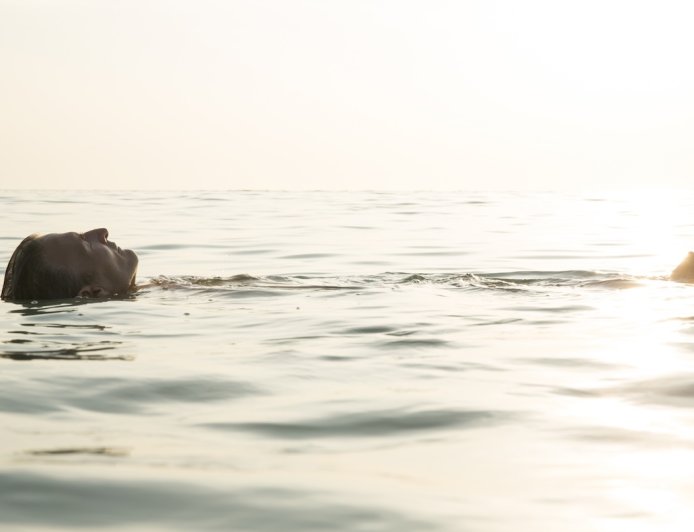Man Accidentally Crashes Beach Fashion Show to Go for a Swim