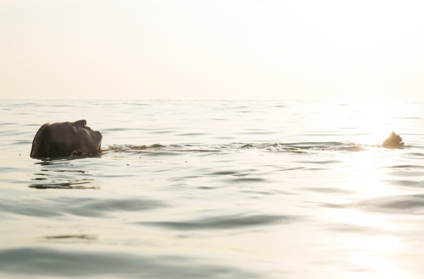 Man Accidentally Crashes Beach Fashion Show to Go for a Swim